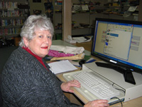 This volunteer assists in the school library. This volunteer assists in the school library.